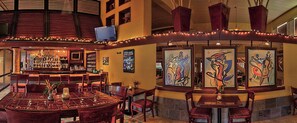 Enjoy a drink at the bar, which offers a variety of liquor and seating options for groups and individuals.