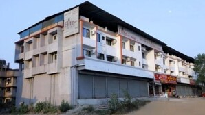 A multi-story building with signage for 'Elite Hotel' and 'Elite Hotel Restaurant'. - Hotel Elite Inn (Mawal)