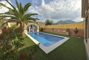 Outdoor pool, open 11:00 AM to 10:00 PM, pool loungers