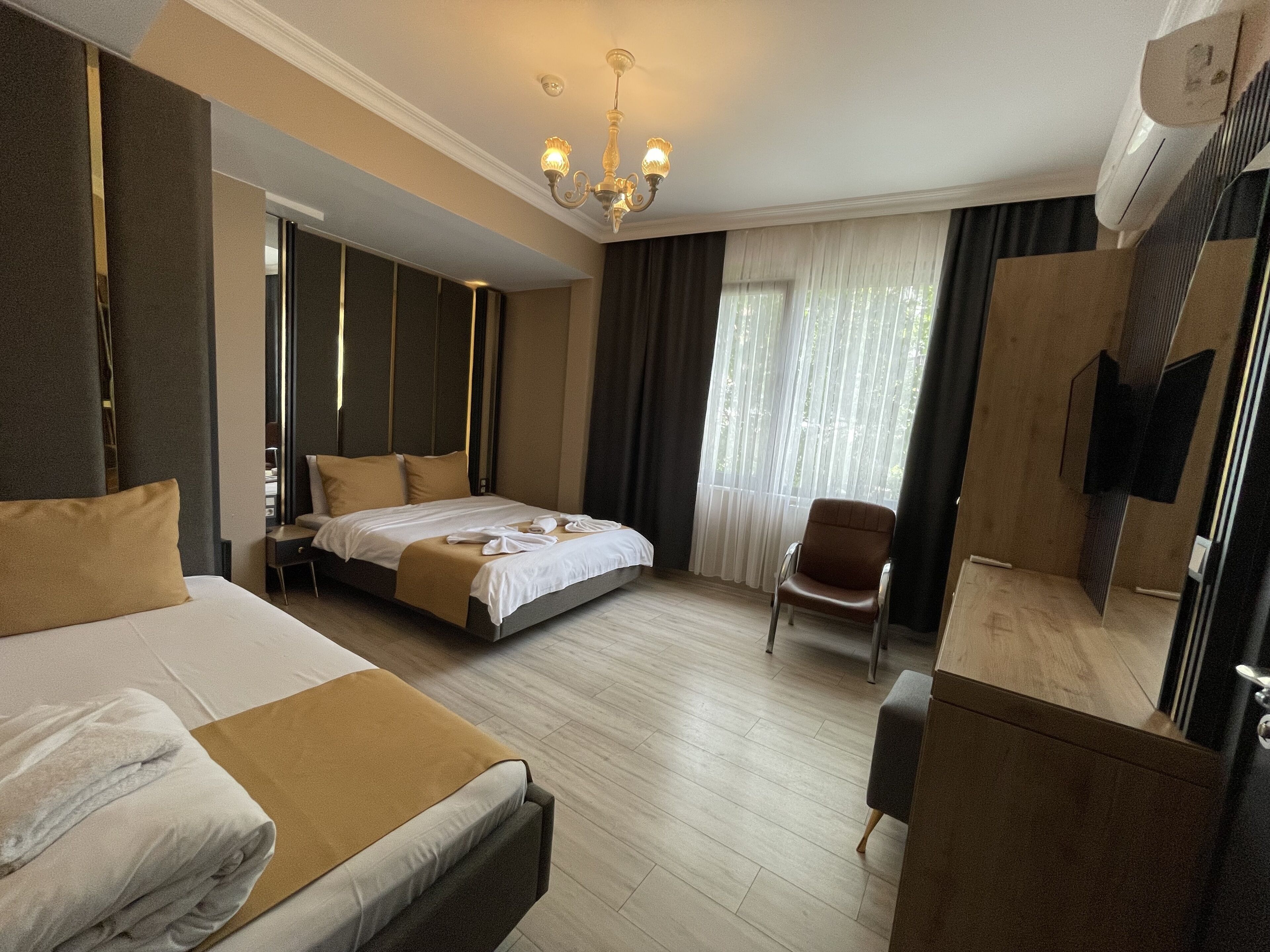 Standard Triple Room | Minibar, iron/ironing board, free WiFi, bed sheets
