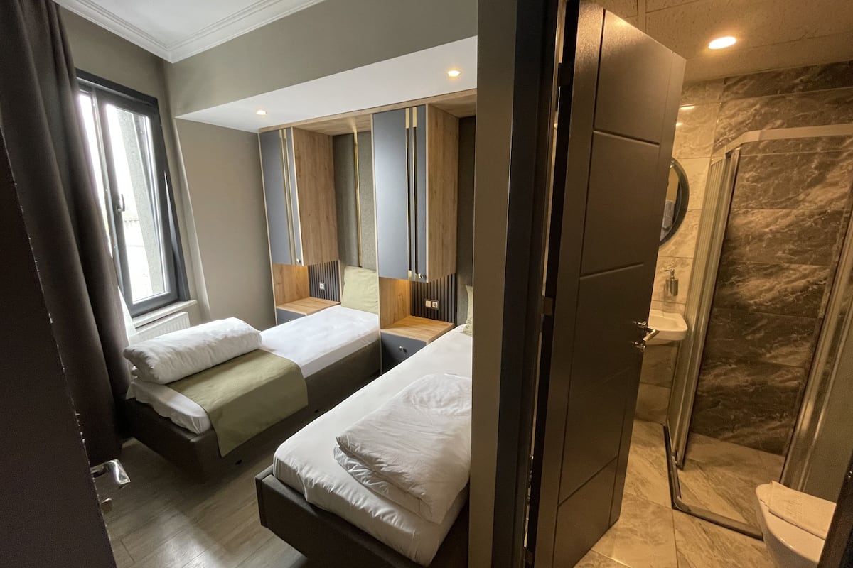 Family Room, City View | Minibar, iron/ironing board, free WiFi, bed sheets