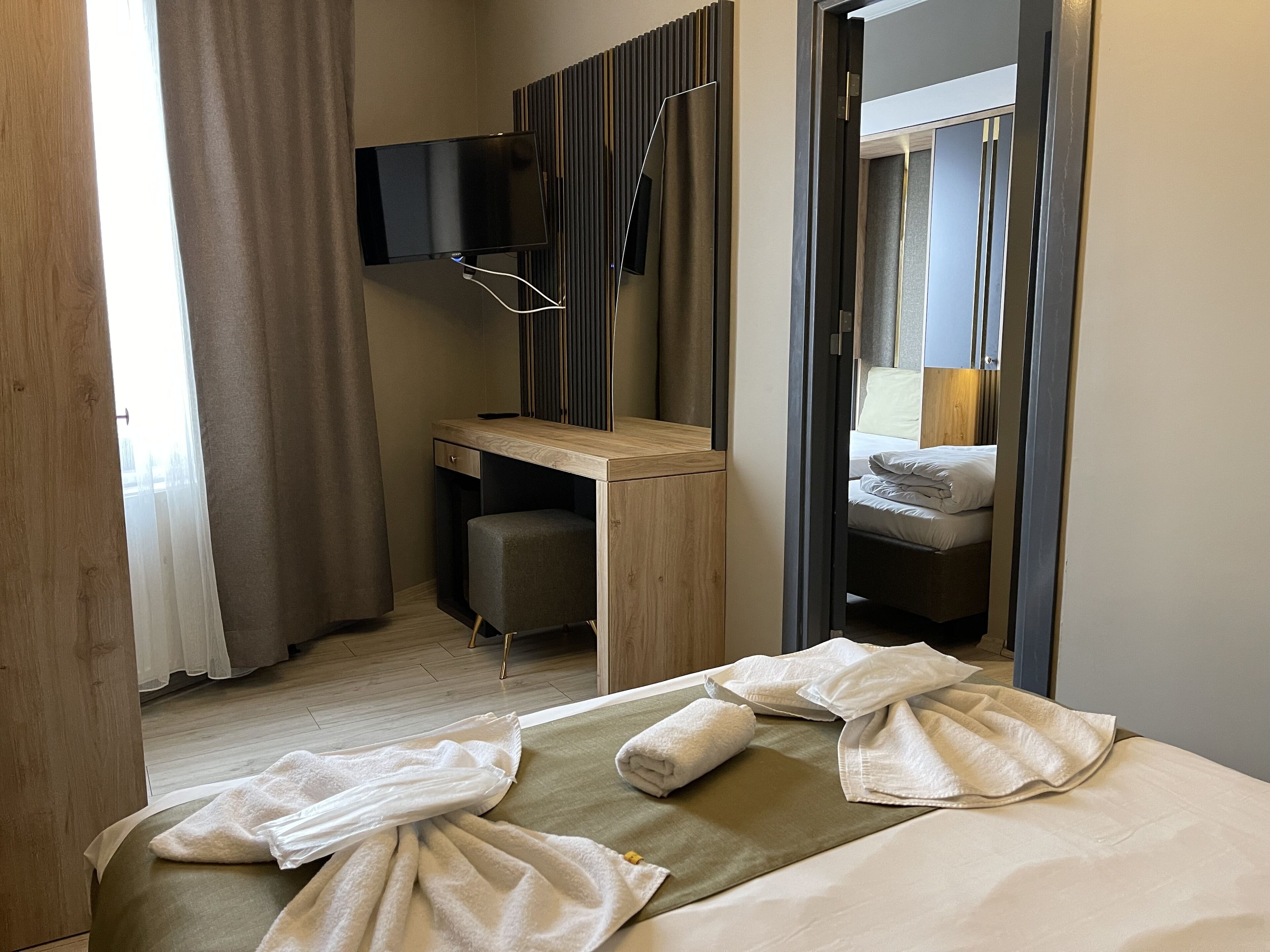 Family Room, City View | Minibar, iron/ironing board, free WiFi, bed sheets