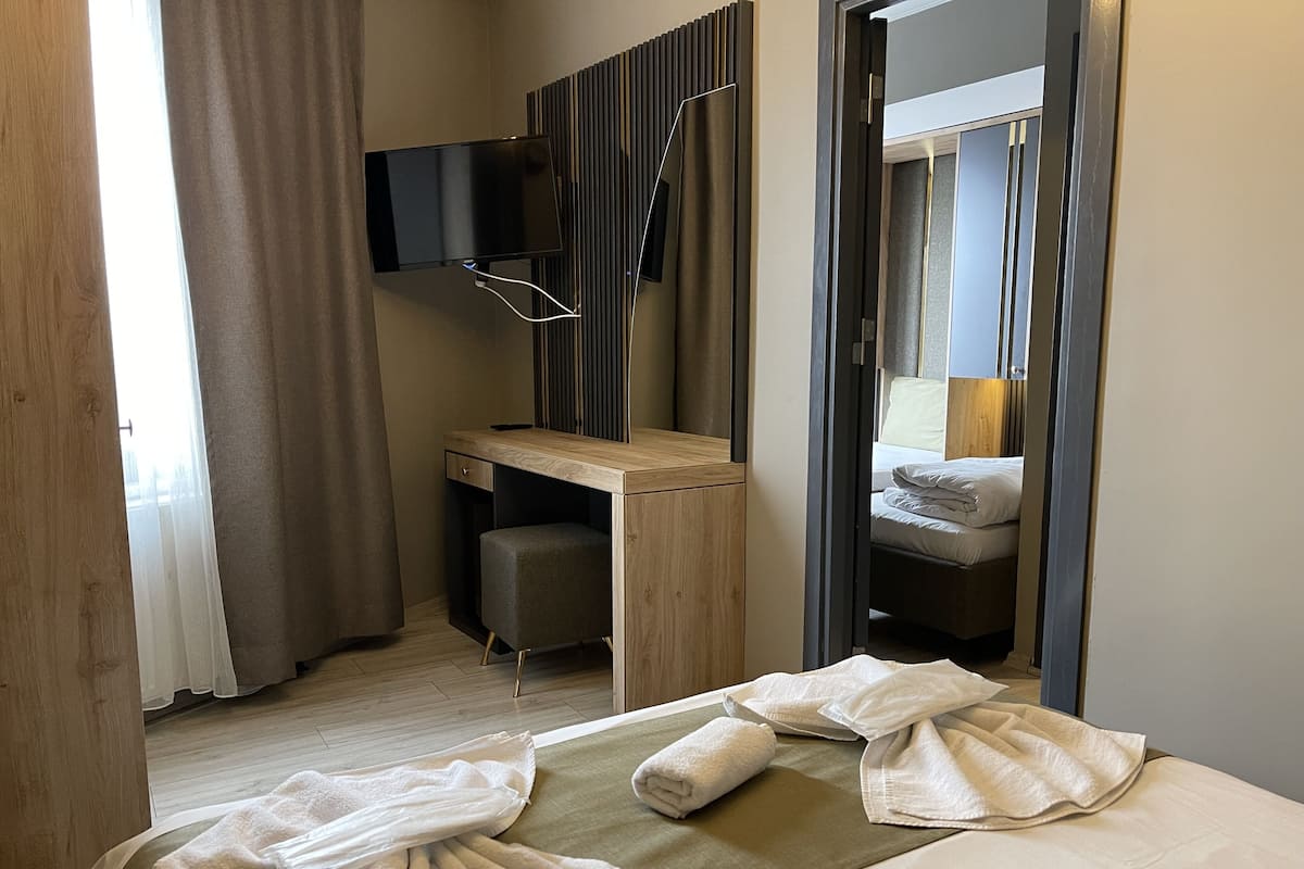 Family Room, City View | Minibar, iron/ironing board, free WiFi, bed sheets