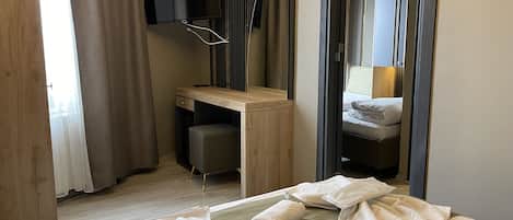 Family Room, City View | Minibar, iron/ironing board, free WiFi, bed sheets