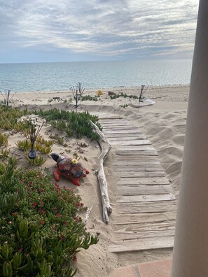 On the beach, sun loungers, beach towels