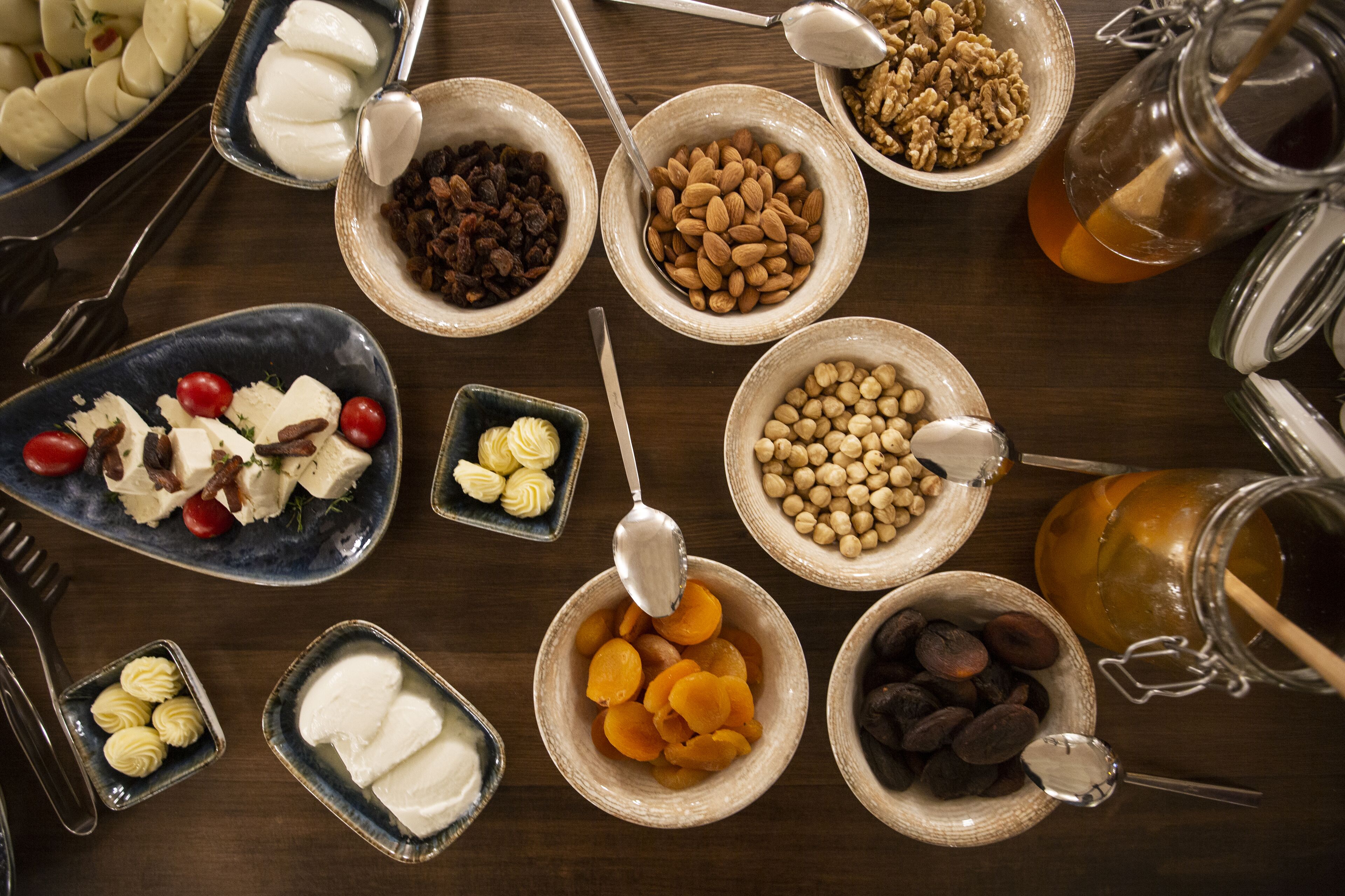 A variety of food items arranged on a wooden table.