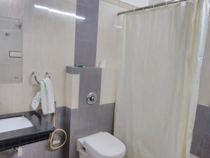 Shower, rainfall showerhead, slippers, towels