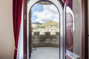 Deluxe Quadruple Room, Multiple Beds, Partial Sea View | Premium bedding, in-room safe, individually decorated