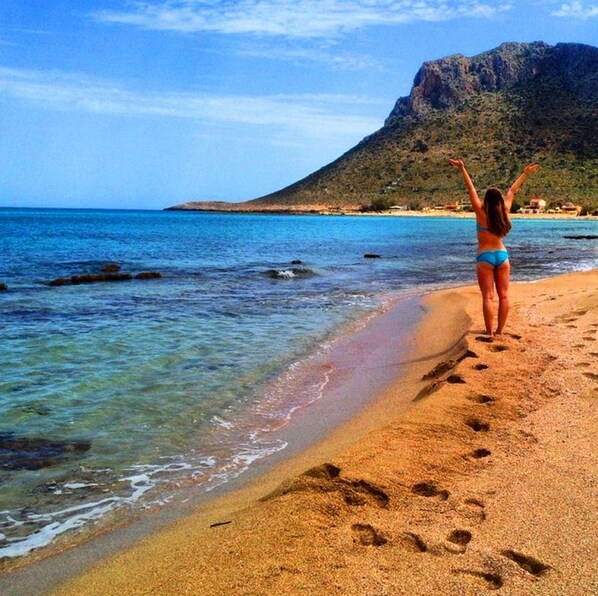 On the beach, sun loungers, beach towels
