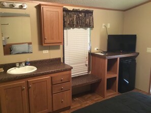 Comfort Studio, 1 Double Bed | Private kitchenette | Full-sized fridge, microwave, stovetop, cookware/dishes/utensils - Palmetto Oasis RV Resort (Sweeny)