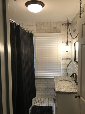 Combined shower/bathtub, hair dryer, towels, soap