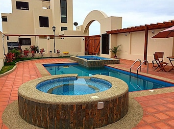 An adult pool, children's pool and jacuzzi