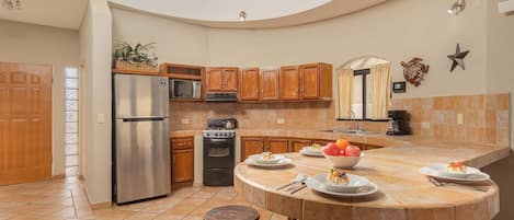 Fridge, microwave, coffee/tea maker, cookware/dishes/utensils