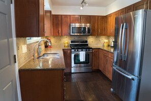 Fridge, microwave, oven, stovetop - Comfortable Boutique Home in a quiet wooded neighborhood; close to everything (Anchorage)