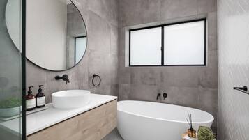 Bathtub, hair dryer, towels