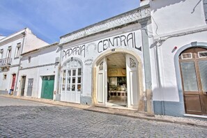 Experience the charm of Padera Central, a traditional building with a historic façade and arched entrance.