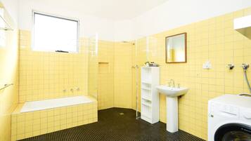 Bathtub, hair dryer, towels
