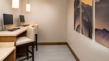 Stay productive with a desk and comfortable chair, plus a large wall art piece.
