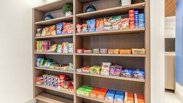 A well-organized snack and food aisle in a store with various packaged goods.