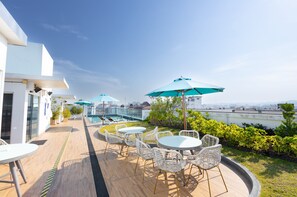 Outdoor pool, open 8:00 AM to 8:00 PM, pool loungers