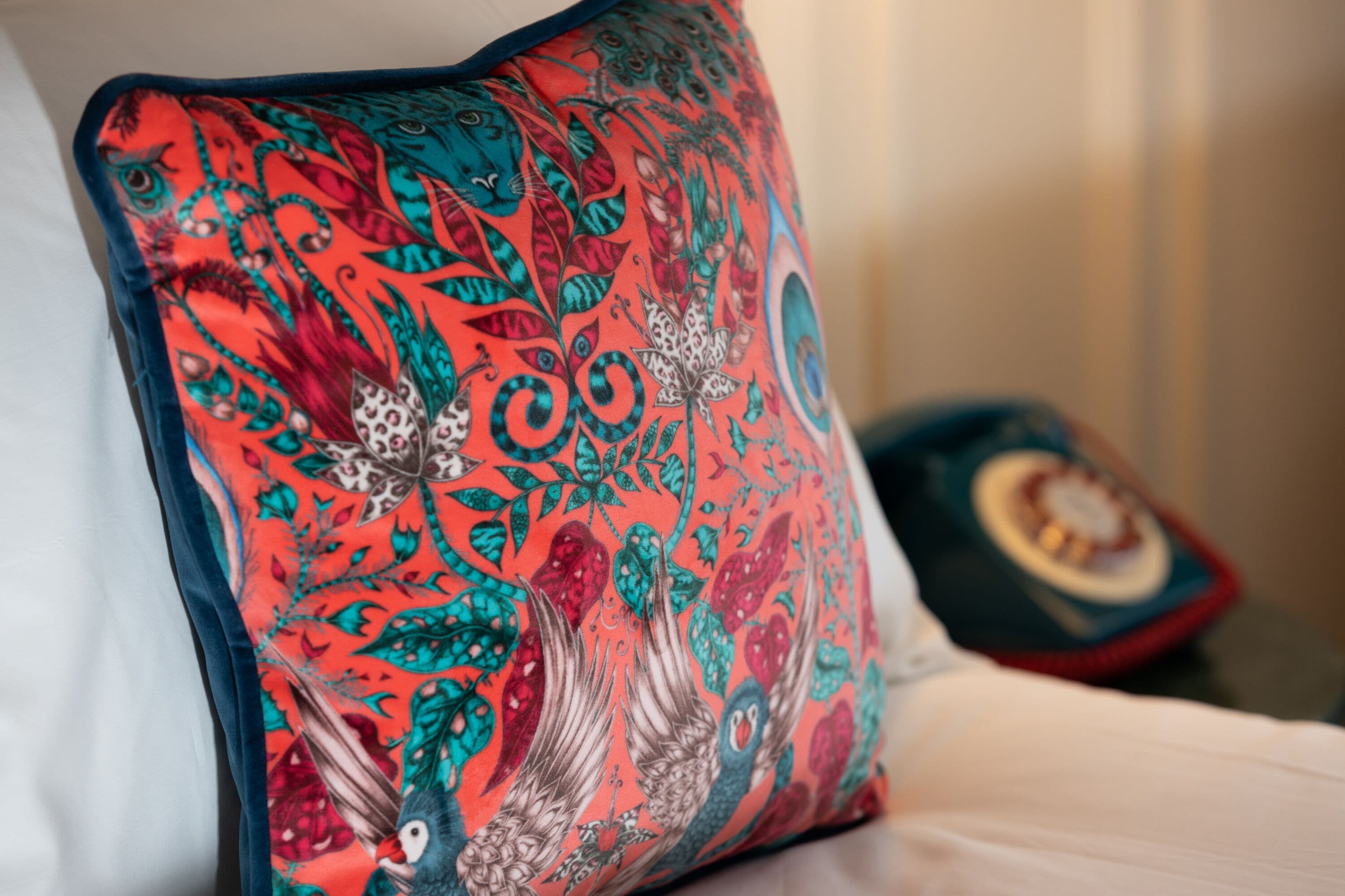 A pillow with a vibrant, intricate pattern.