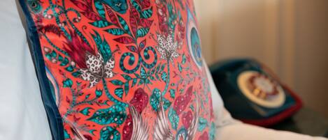 A pillow with a vibrant, intricate pattern.