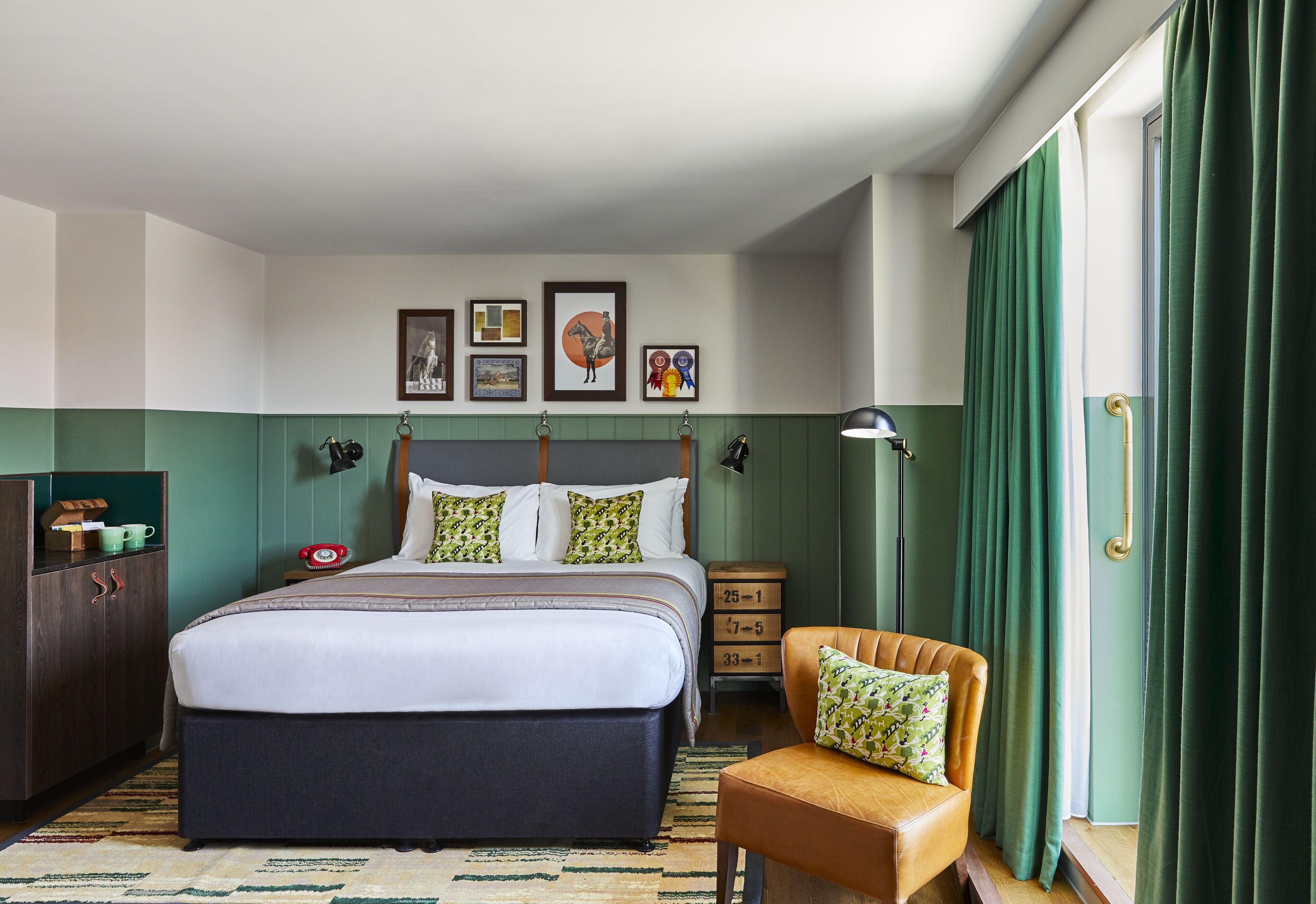 A neatly arranged bedroom with a large bed, a nightstand, a chair, and a dresser.