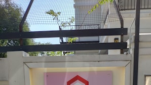A sign for Wawasan Homestay with a simple, clean design and a logo. - Wawasan Homestay Butterworth (Butterworth)