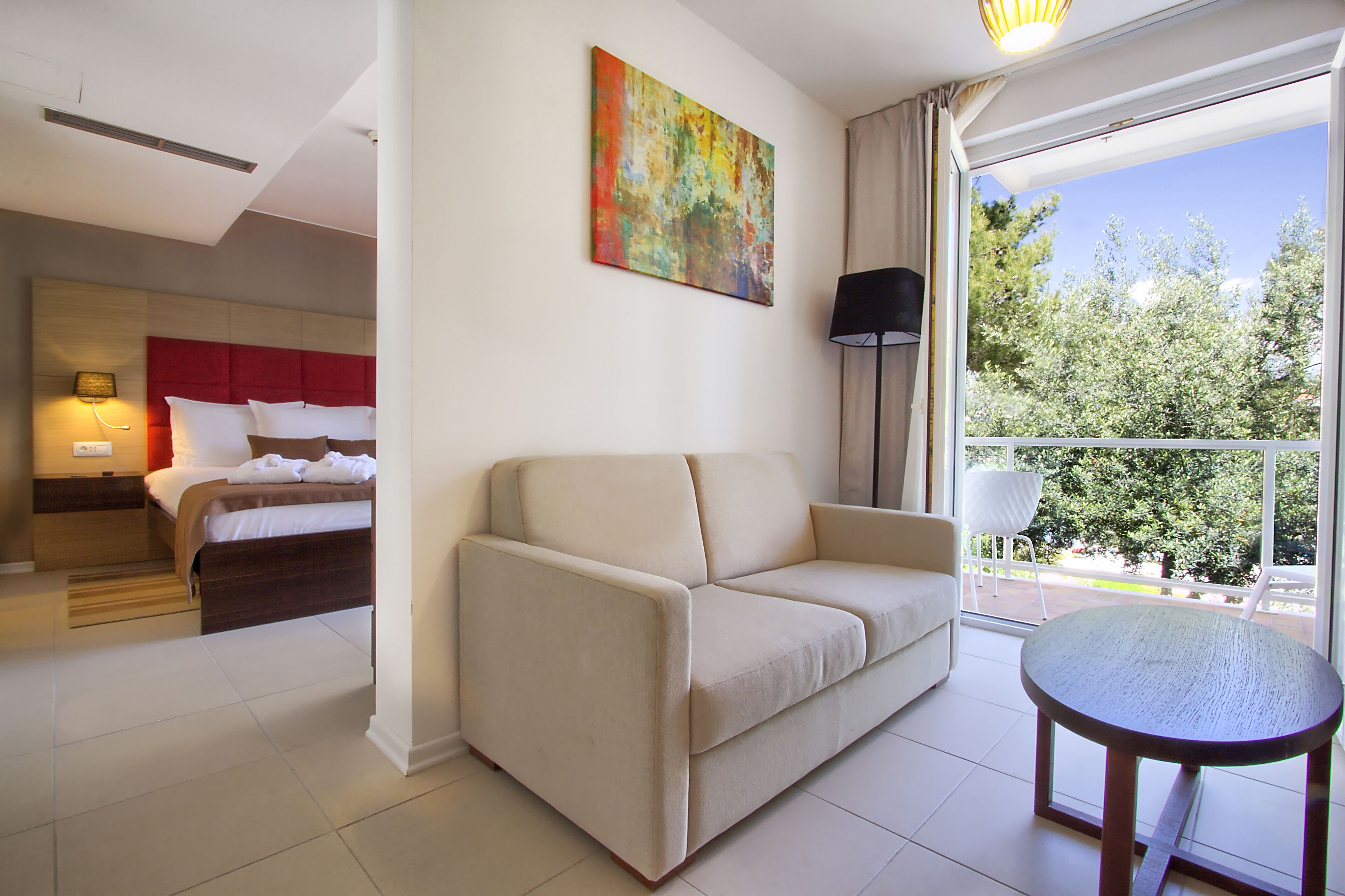 junior suite, partial sea view | in-room safe, desk, blackout curtains, soundproofing