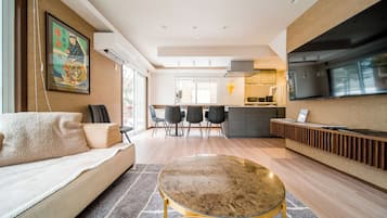 Family House, 5 Bedrooms | Living area | 65-inch Smart TV with cable channels