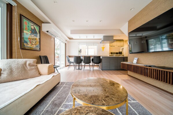 Family House, 5 Bedrooms | Living area | 65-inch Smart TV with cable channels