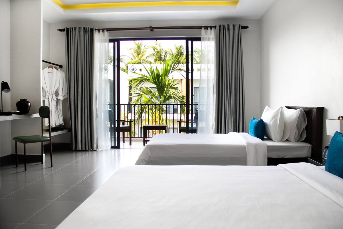 Triple Suite with Pool View | Minibar, in-room safe, desk, blackout drapes