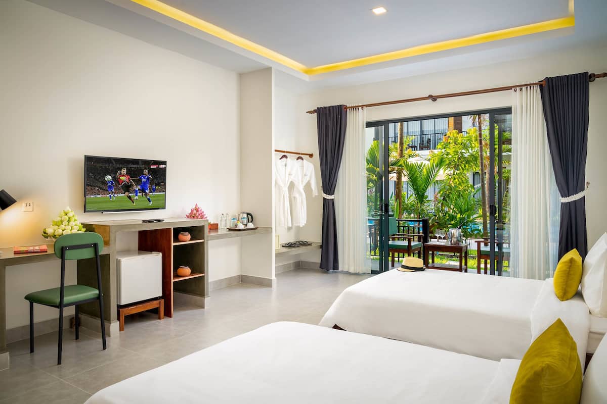 Suite Twin with Pool View | Minibar, in-room safe, desk, blackout drapes