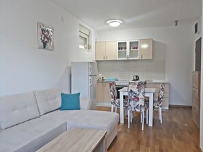 Comfort Apartment, Courtyard View | Living area | Flat-screen TV