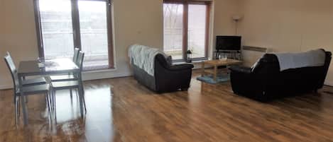 Apartment, 3 Bedrooms | Living area | Flat-screen TV