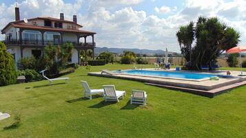 Seasonal outdoor pool, pool loungers