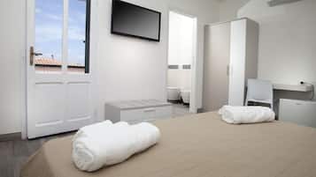 Habitación doble | 1 habitación, caja de seguridad en la habitación y escritorio