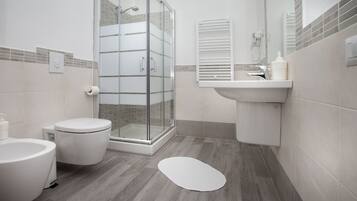 Double Room | Bathroom | Shower, hair dryer, bidet, towels