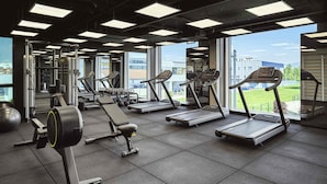 A gym with treadmills, weight benches, and exercise balls. - Mövenpick Zagreb (Zagreb)
