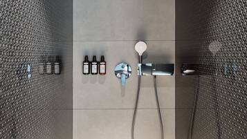 Shower, designer toiletries, hair dryer, slippers