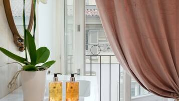 Rainfall showerhead, designer toiletries, hair dryer, slippers