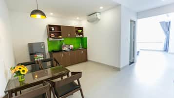 Fridge, electric kettle, cleaning supplies, paper towels