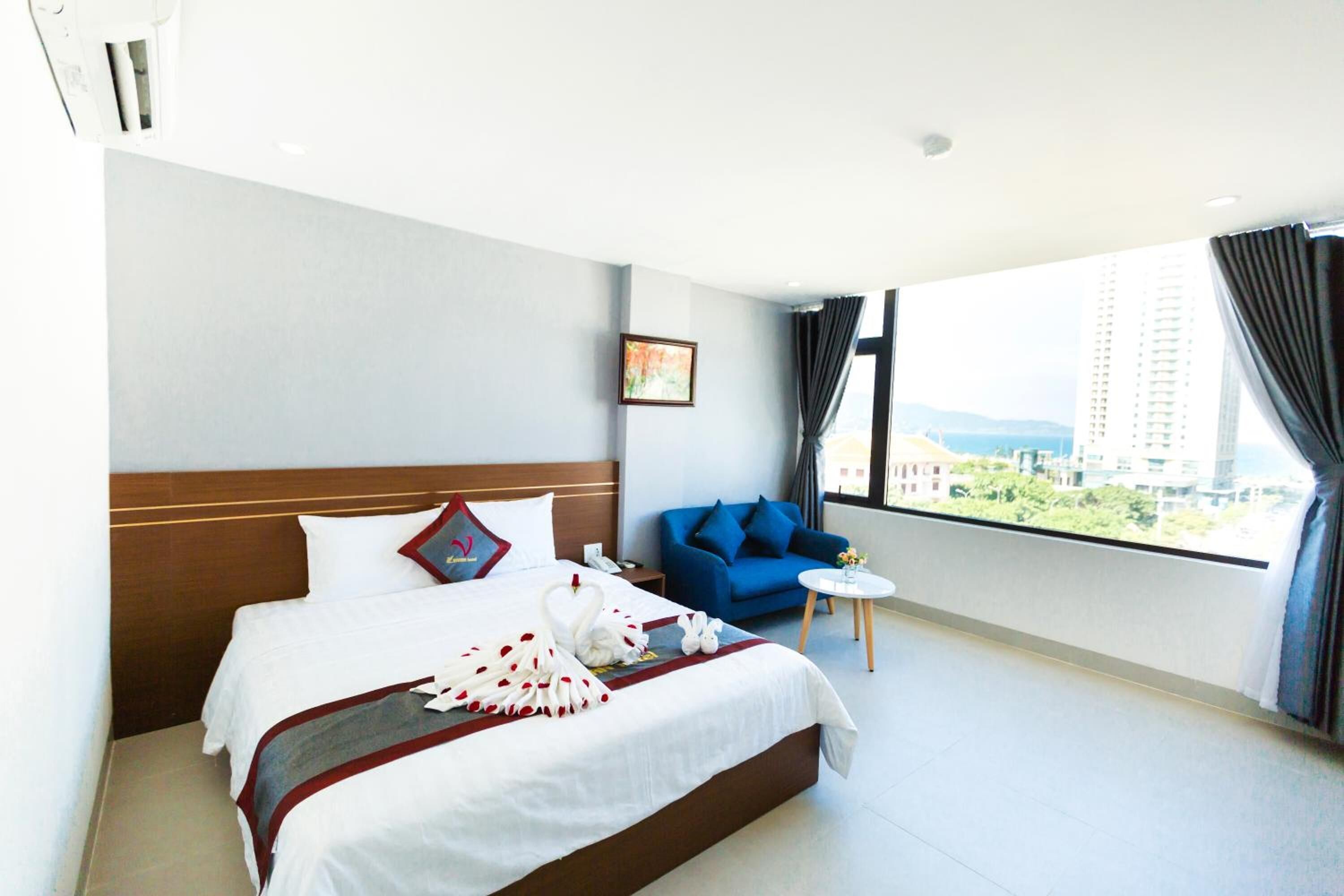 Minibar, desk, blackout curtains, iron/ironing board
