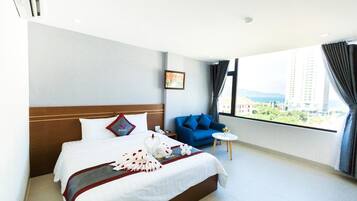 Minibar, desk, blackout curtains, iron/ironing board