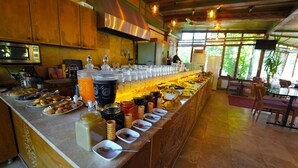 A buffet setup with various food items and beverages. - Grand Elite Cave Suites (Nevsehir)