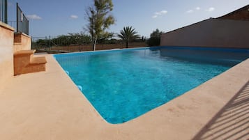 Seasonal outdoor pool, pool umbrellas, sun loungers