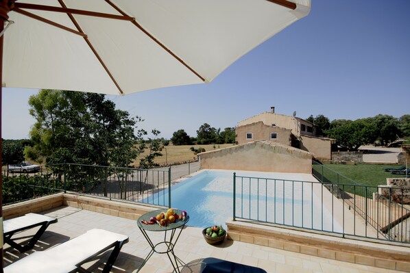 Seasonal outdoor pool, pool umbrellas, pool loungers