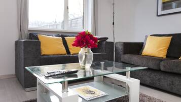 Family House, Multiple Beds | Living area | Flat-screen TV