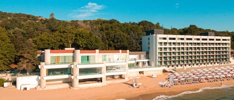 On the beach, sun loungers, beach umbrellas, beach towels