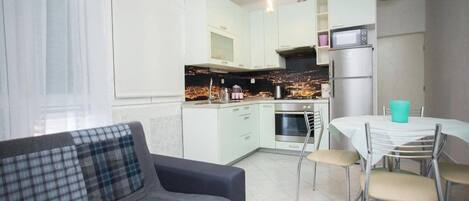 Apartment, 1 Doppelbett und Schlafsofa | Wohnbereich | Fernseher